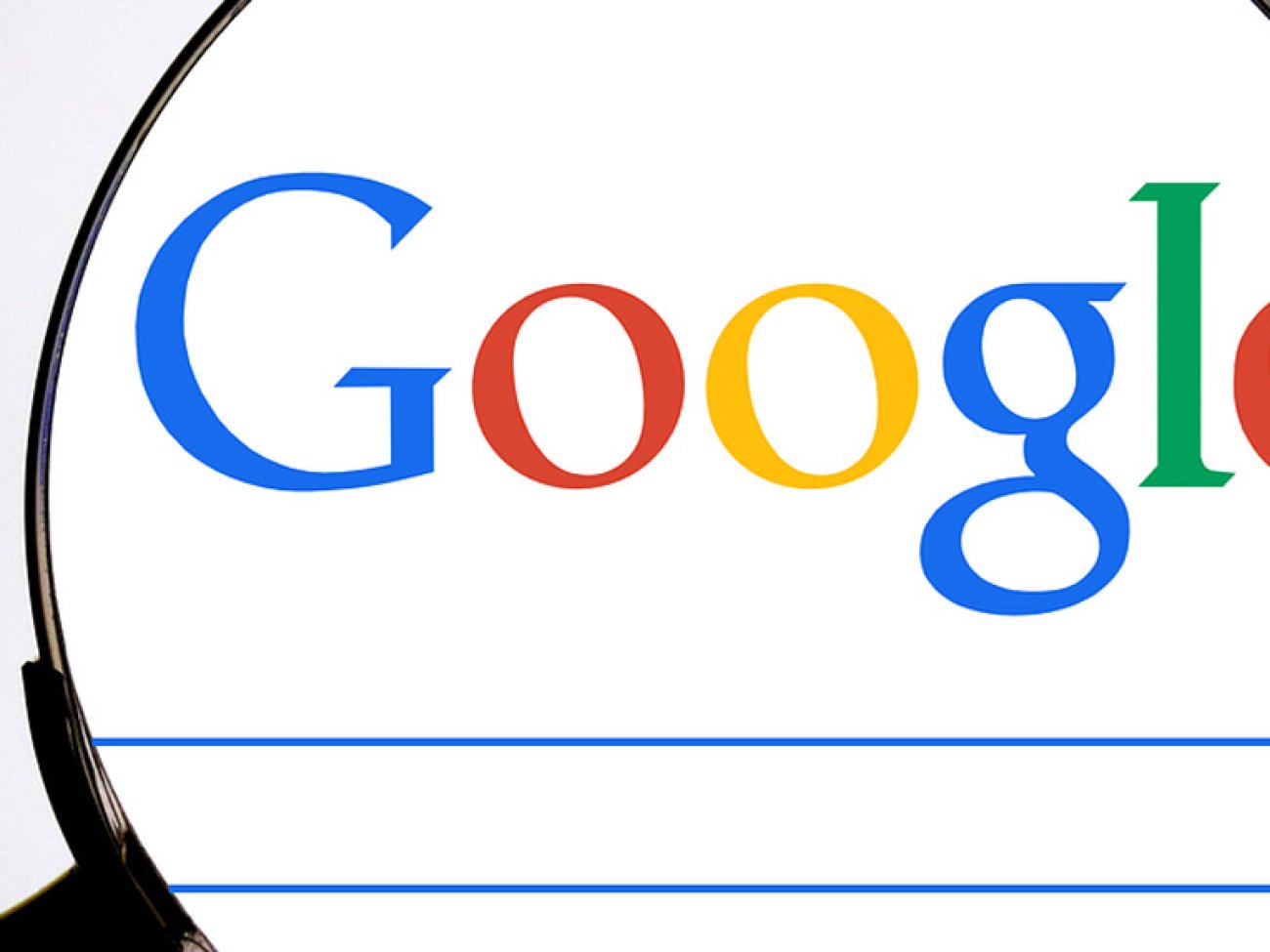 Google logo under magnifying glass