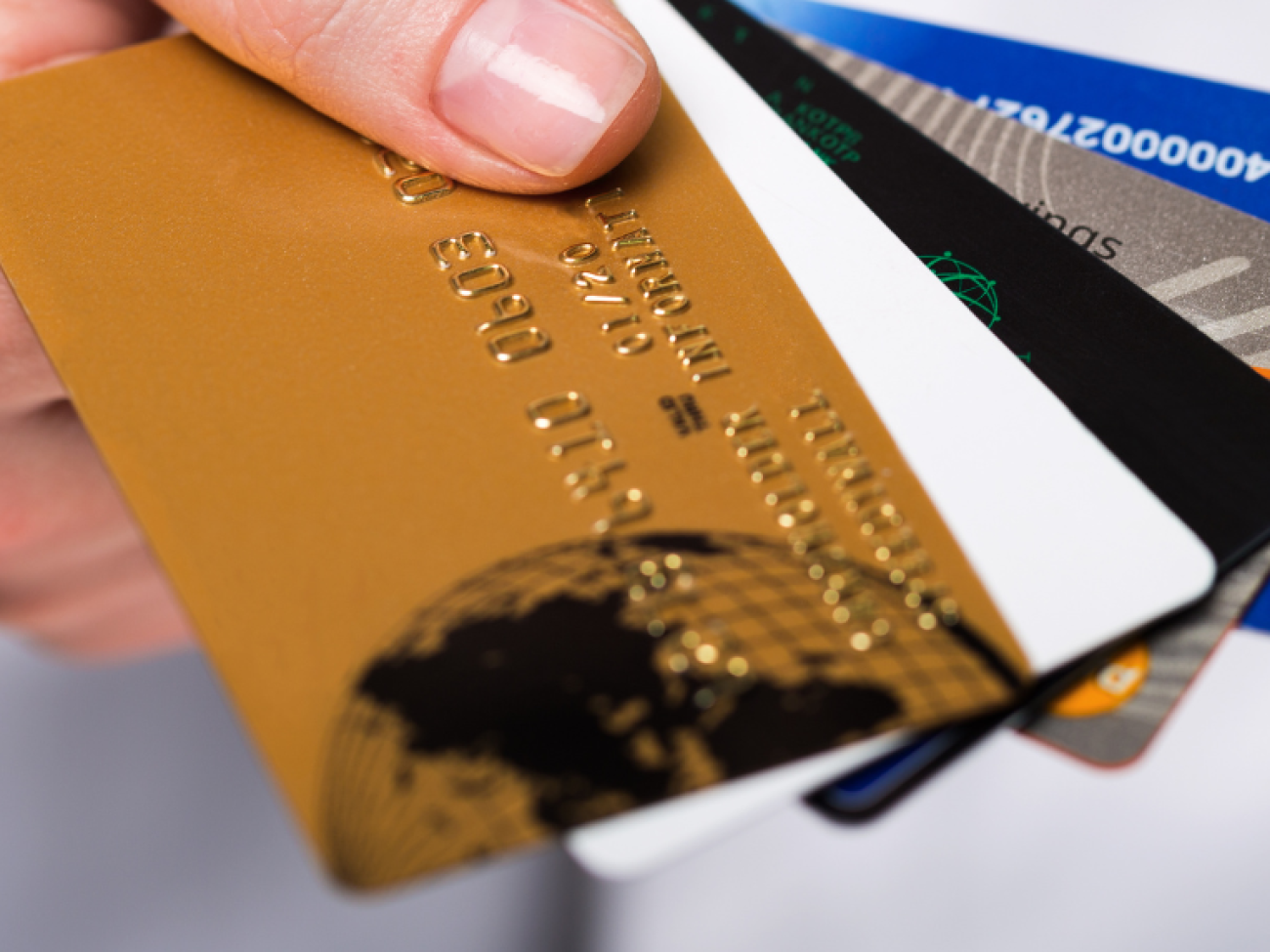 Hand holding multiple credit cards