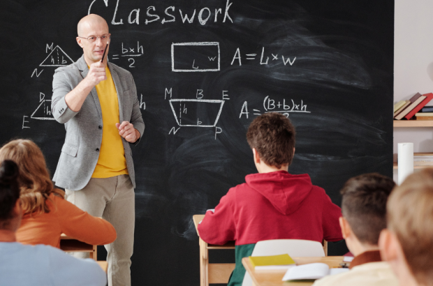 Teacher instructing students