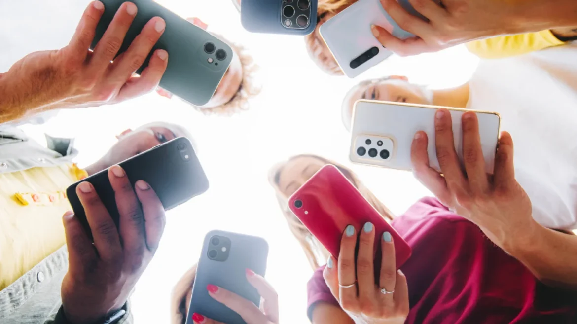 Teenagers using smartphones