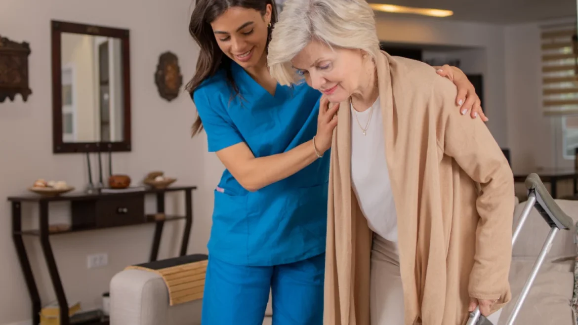 Caregiver assisting elderly woman