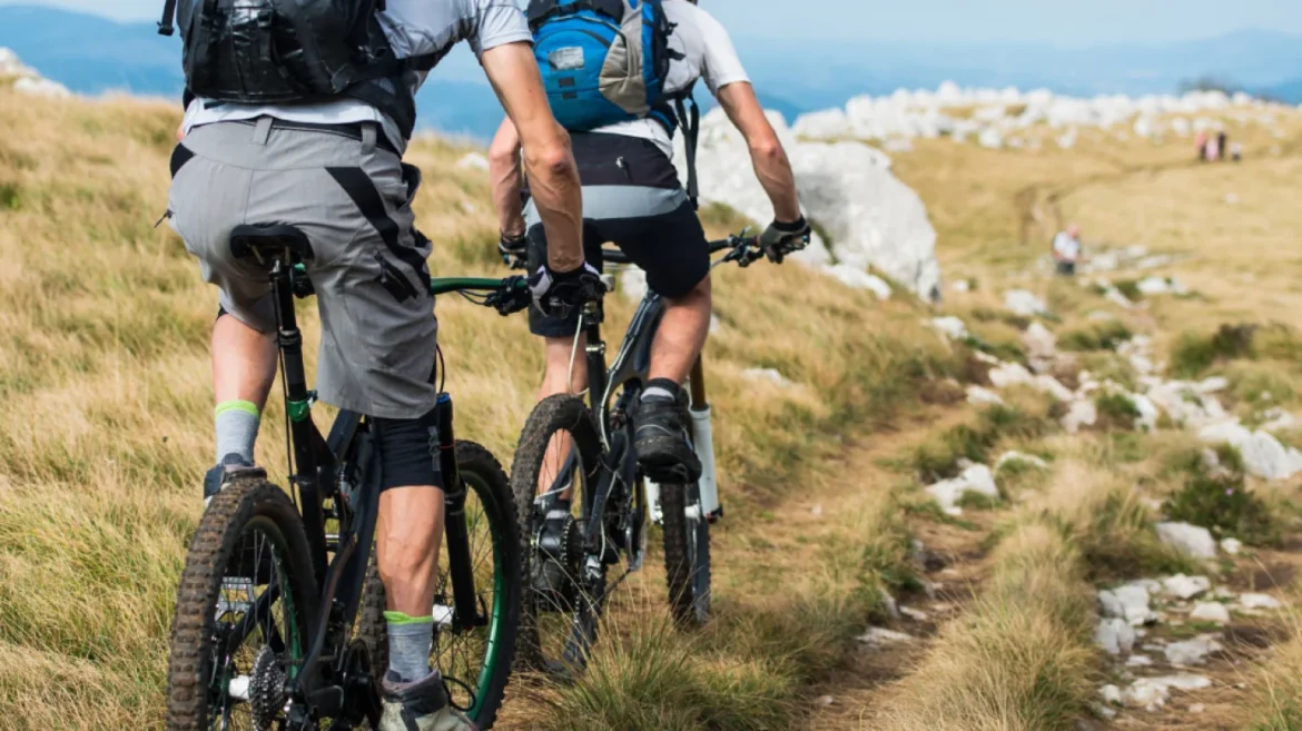 Cyclist atop Scottish Munro