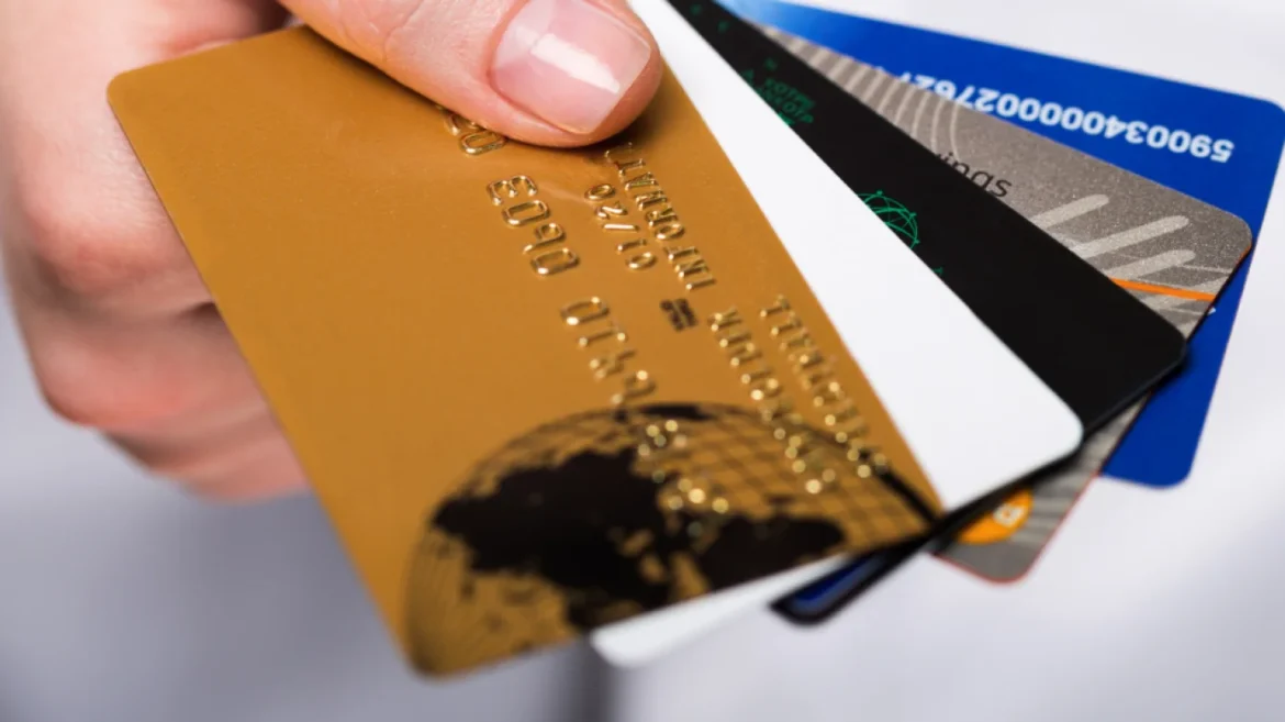 Hand holding multiple credit cards